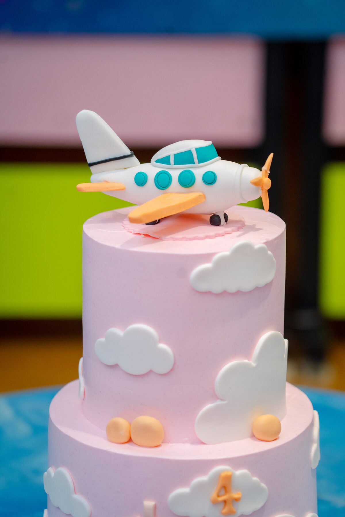 Two-tier pastel birthday cake with an aeroplane topper at Baccha Party Powai