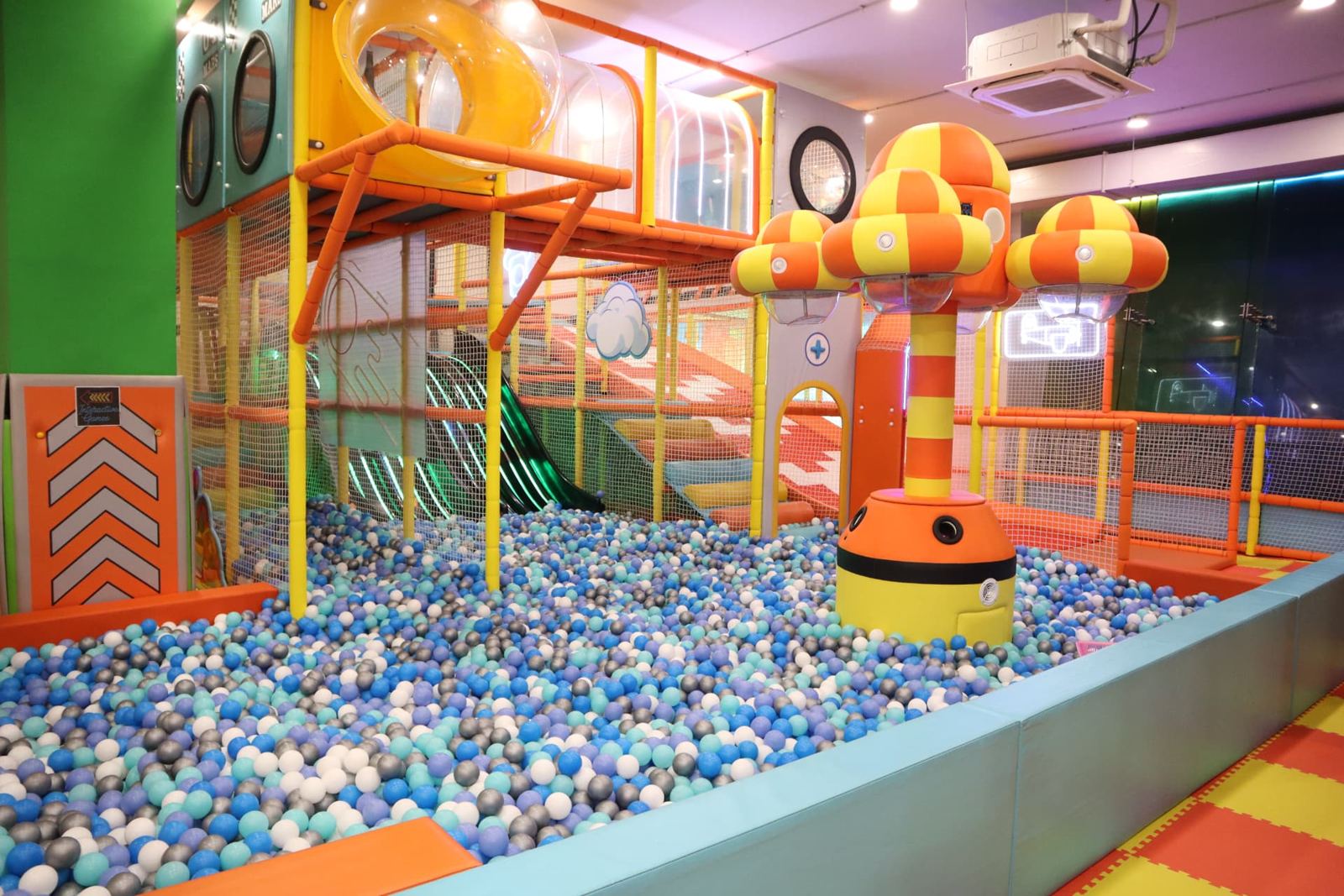 Ball pit beneath the multi-level play structure at Baccha Party Vashi