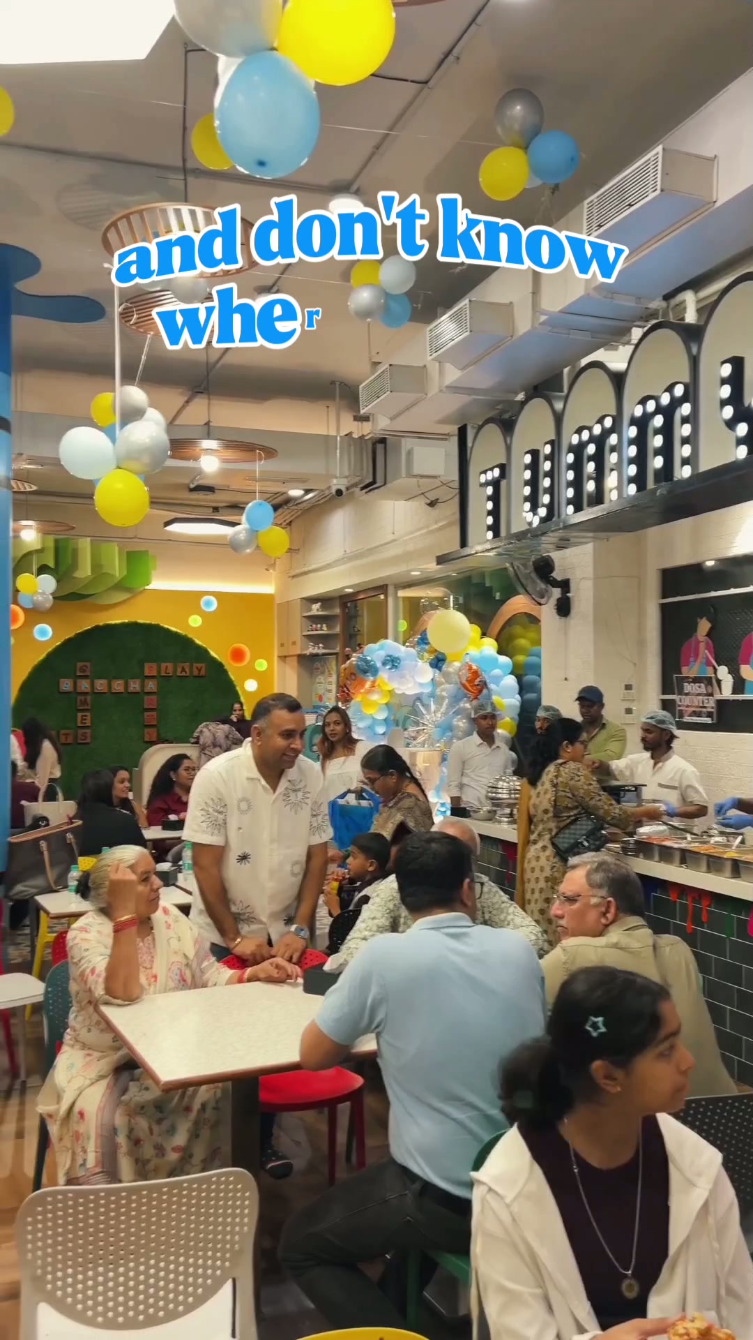Families seated beneath pastel balloons during a birthday party at Baccha Party Vashi