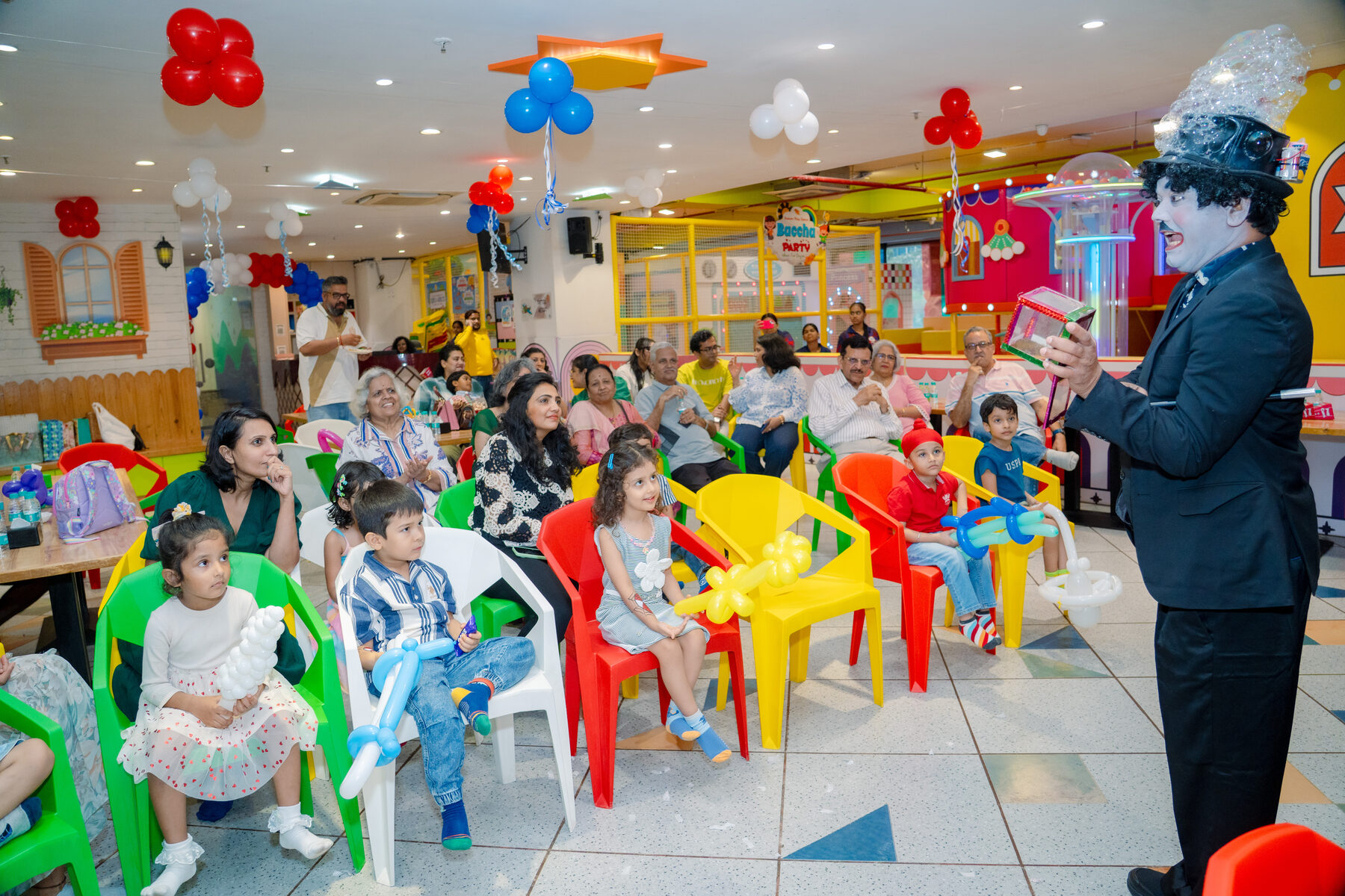 Children watching a magician perform at a Baccha Party Powai birthday