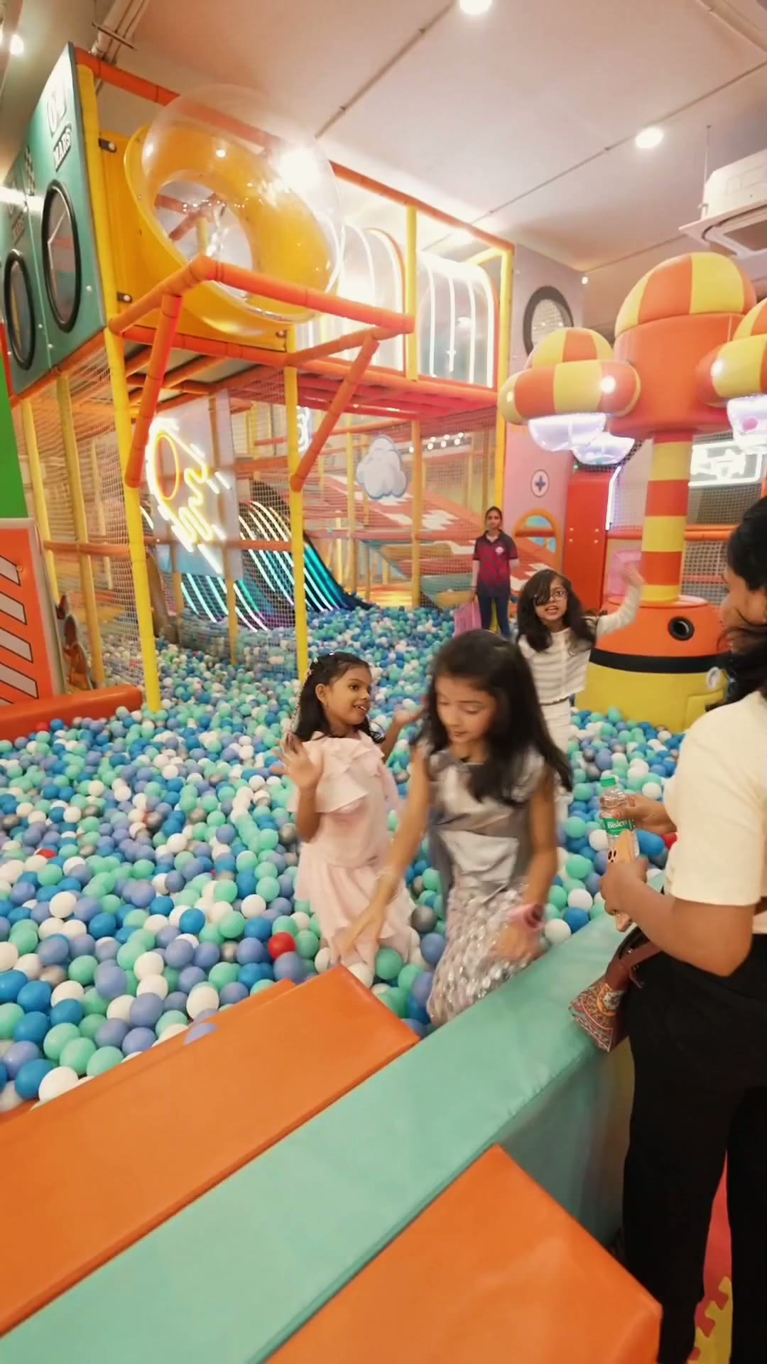 Children in party clothes playing in the ball pit during a birthday celebration at Baccha Party Vashi